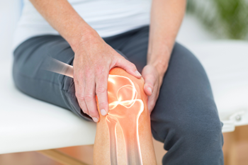 Knee joint anatomy showing cartilage cushion between bones